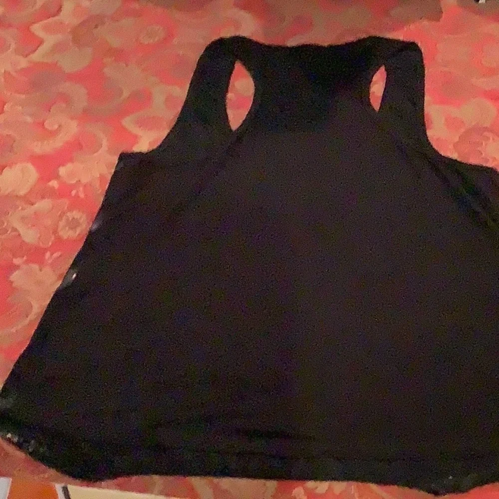 Delia’s small animal print Racer back top, black with sparkles on front